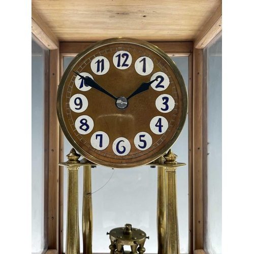 2929 - A walnut cased 400 day torsion clock, circa 1920, the brass framed circular copper dial with blue an... 