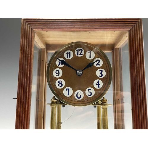 2929 - A walnut cased 400 day torsion clock, circa 1920, the brass framed circular copper dial with blue an... 