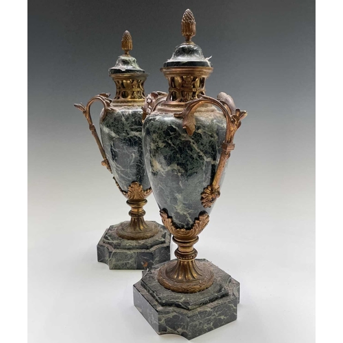 293 - A pair of French ormolu mounted green marble urns and covers, in the Louis XV style, circa 1900, the... 