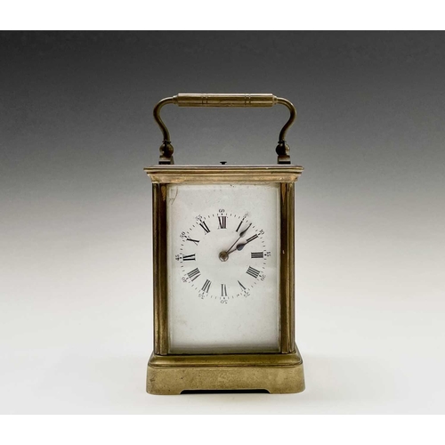 2930 - A French brass repeating carriage clock, circa 1900, with white enamel dial, striking on a coiled go... 