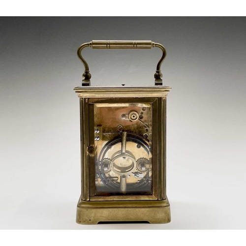 2930 - A French brass repeating carriage clock, circa 1900, with white enamel dial, striking on a coiled go... 