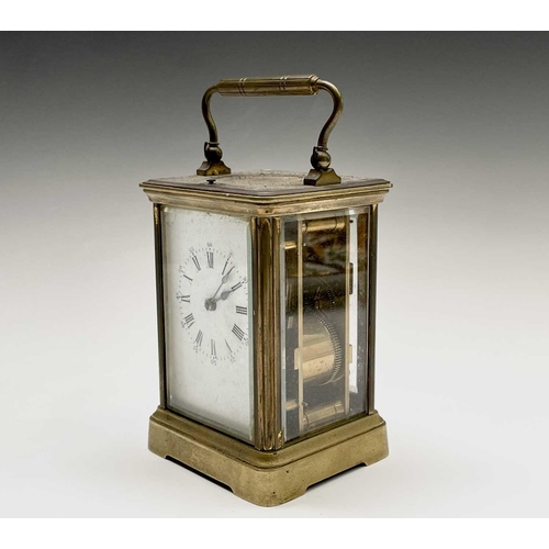 2930 - A French brass repeating carriage clock, circa 1900, with white enamel dial, striking on a coiled go... 