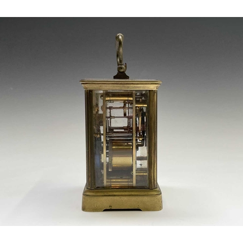 2930 - A French brass repeating carriage clock, circa 1900, with white enamel dial, striking on a coiled go... 