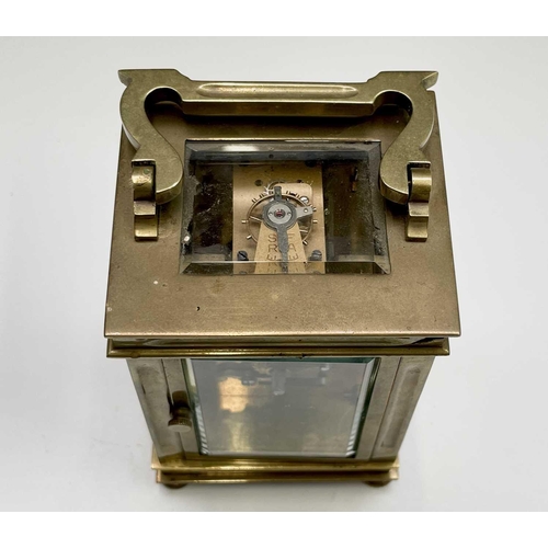 2933 - A French brass cased carriage clock, early 20th century, on turned feet, height 12.5cm.