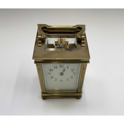 2933 - A French brass cased carriage clock, early 20th century, on turned feet, height 12.5cm.