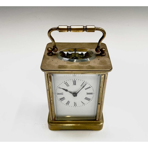 2934 - A French brass cased carriage timepiece, with white enamel dial, height 15cm.