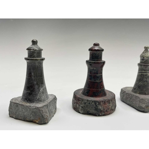 296 - A collection of 18 small Cornish serpentine models of lighthouses, the tallest 15cm, and a turned se... 