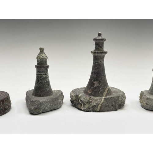 296 - A collection of 18 small Cornish serpentine models of lighthouses, the tallest 15cm, and a turned se... 