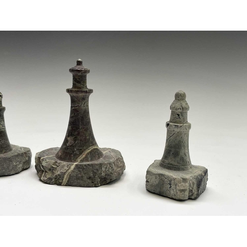 296 - A collection of 18 small Cornish serpentine models of lighthouses, the tallest 15cm, and a turned se... 