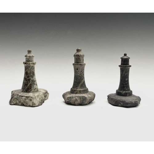 296 - A collection of 18 small Cornish serpentine models of lighthouses, the tallest 15cm, and a turned se... 