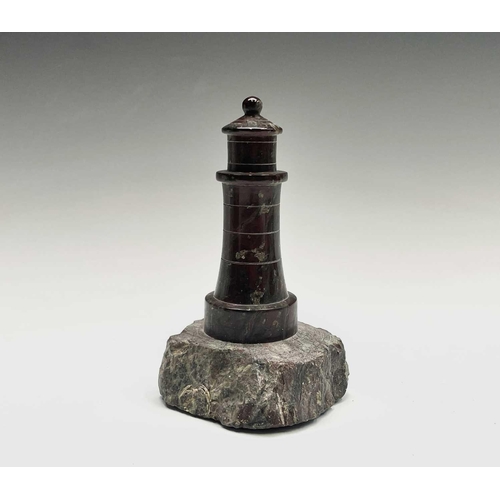 296 - A collection of 18 small Cornish serpentine models of lighthouses, the tallest 15cm, and a turned se... 