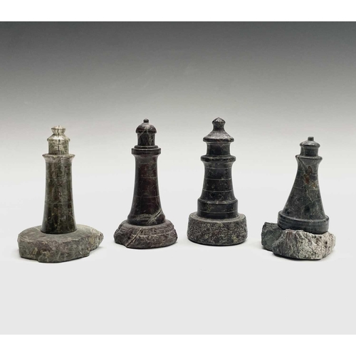 296 - A collection of 18 small Cornish serpentine models of lighthouses, the tallest 15cm, and a turned se... 