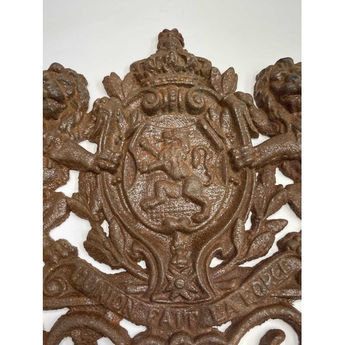 298 - A cast iron coat of arms, inscribed 'Union Fait La Force', width 36cm.