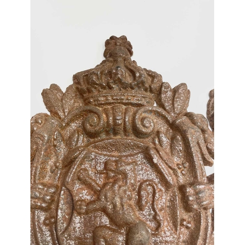 298 - A cast iron coat of arms, inscribed 'Union Fait La Force', width 36cm.