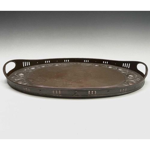 3 - A Newlyn copper oval tray, circa 1910, the raised edge with twin handles, the border repousse decora... 