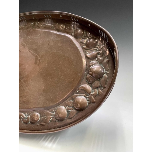 3 - A Newlyn copper oval tray, circa 1910, the raised edge with twin handles, the border repousse decora... 