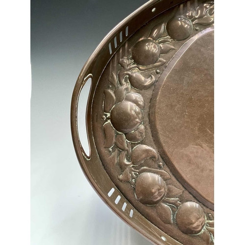 3 - A Newlyn copper oval tray, circa 1910, the raised edge with twin handles, the border repousse decora... 