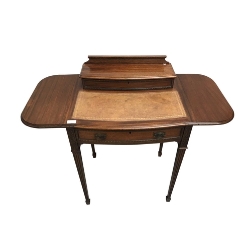 3004 - An Edwardian mahogany lady's writing desk, the higned top opening to reveal a fitted interior, brown... 