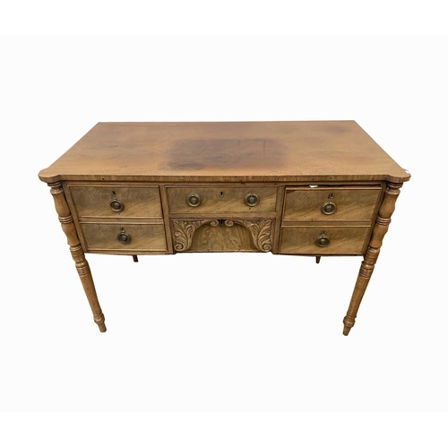 3012 - A late Georgian mahogany sideboard, of small proportions, with five drawers surrounding a leaf carve... 