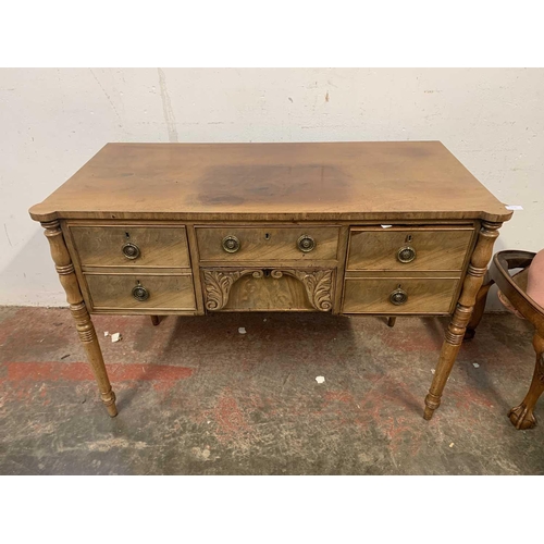 3012 - A late Georgian mahogany sideboard, of small proportions, with five drawers surrounding a leaf carve... 