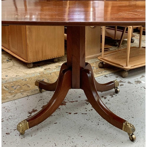 3013 - A George IV mahogany tilt top supper table, with rounded corners, on a tapering octagonal pillar and... 