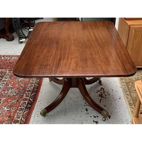 3013 - A George IV mahogany tilt top supper table, with rounded corners, on a tapering octagonal pillar and... 