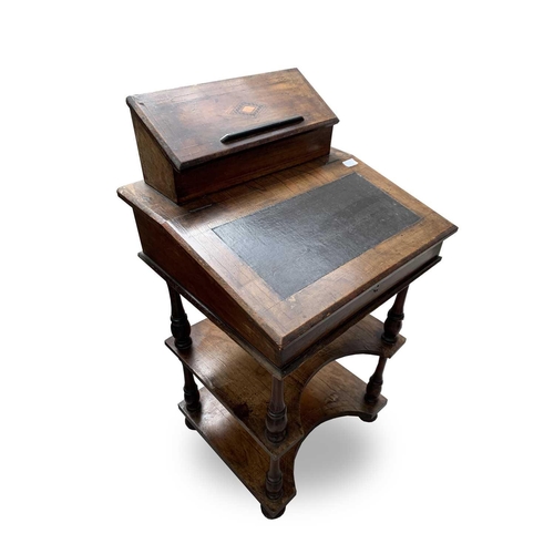 3014 - A Victorian inlaid walnut davenport, the hinged top with a fitted interior above two tiers joined by... 