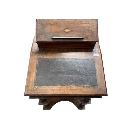 3014 - A Victorian inlaid walnut davenport, the hinged top with a fitted interior above two tiers joined by... 