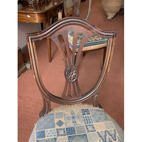 3019 - A set of four Edwardian mahogany Hepplewhite style dining chairs, with shield backs and upholstered ... 