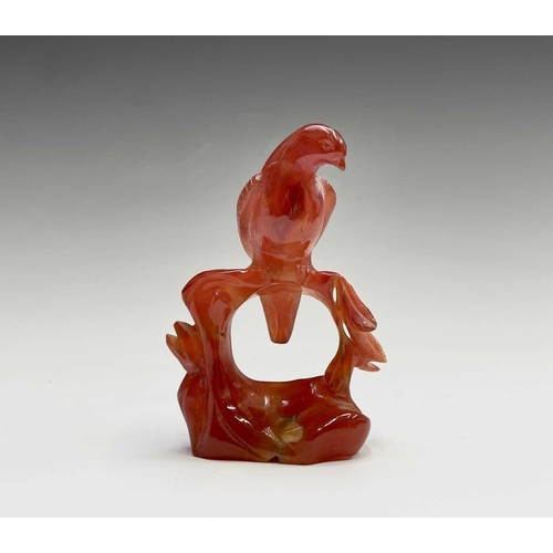 302 - A carved quartz sculpture of a dog, height 5.5cm, together with an agate figure of an eagle, and two... 