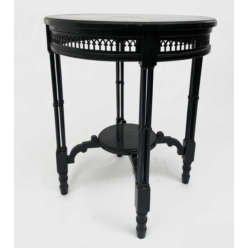 3023 - A late Victorian ebonised circular occasional table, with Gothic pierced frieze and raised on quadru... 