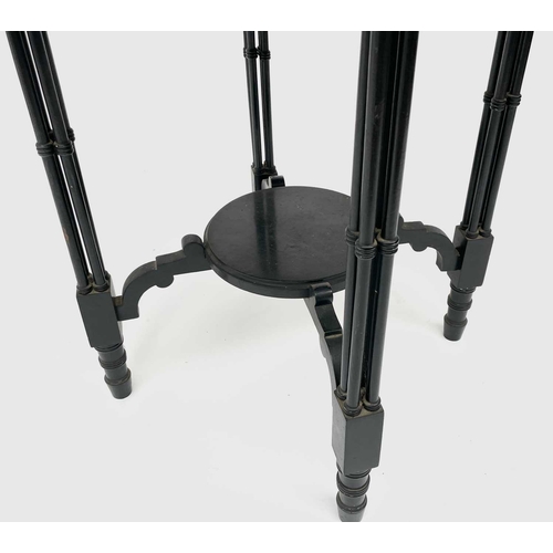 3023 - A late Victorian ebonised circular occasional table, with Gothic pierced frieze and raised on quadru... 