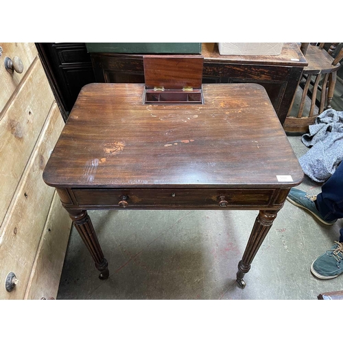 3029 - An early 19th century mahogany side table, in the manner of Gillows, the reeded top with a hinged co... 