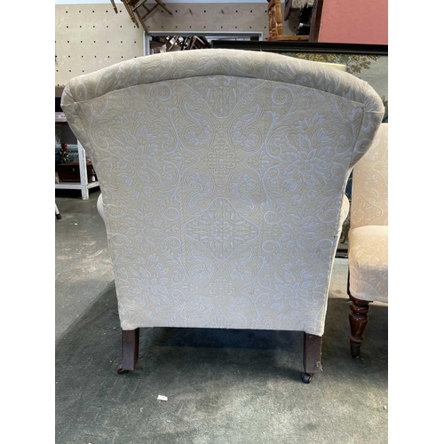 3031 - An Edwardian upholstered armchair on turned front legs, together with a Victorian mahogany nursing c... 