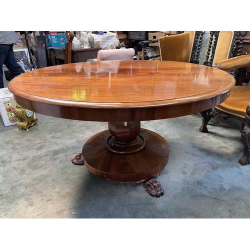 3032 - An early Victorian circular table raised upon an octagonal baluster pedestal and circular base with ... 