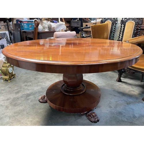 3032 - An early Victorian circular table raised upon an octagonal baluster pedestal and circular base with ... 