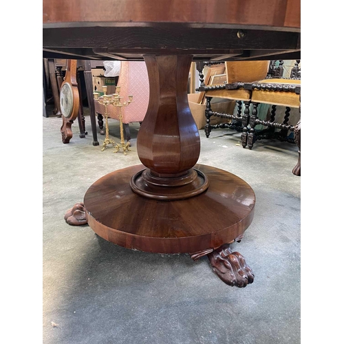 3032 - An early Victorian circular table raised upon an octagonal baluster pedestal and circular base with ... 