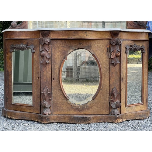 3046 - A Victorian walnut mirror back credenza, with applied carved decoration, the white marble top above ... 