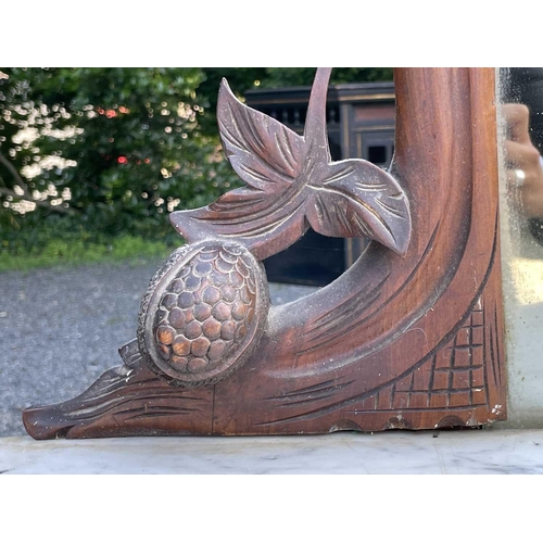 3046 - A Victorian walnut mirror back credenza, with applied carved decoration, the white marble top above ... 