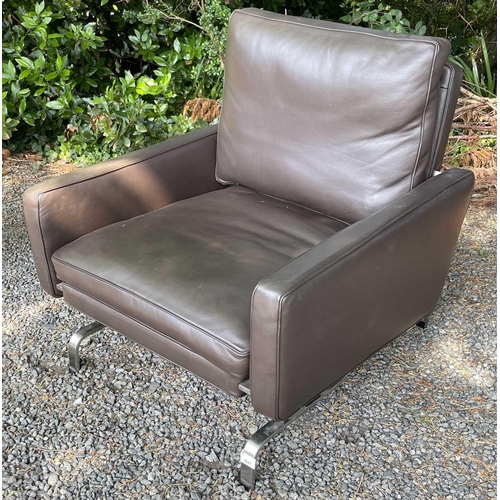 3047 - A contemporary stainless steel and leather upholstered armchair, height 77cm, width 81cm, depth 79cm... 