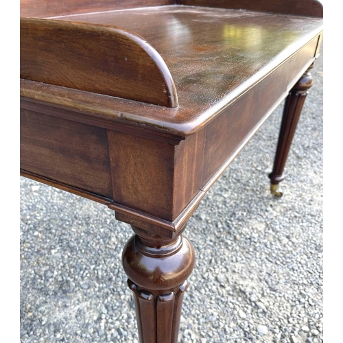 3049 - An early Victorian mahogany tray-top writing table or washstand, in the Gillows taste, fitted two fl... 