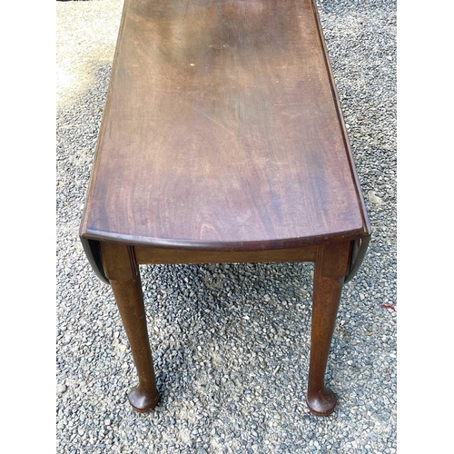 3050 - A George III mahogany dropleaf dining table, raised on five turned legs, with pad feet, height 72cm,... 