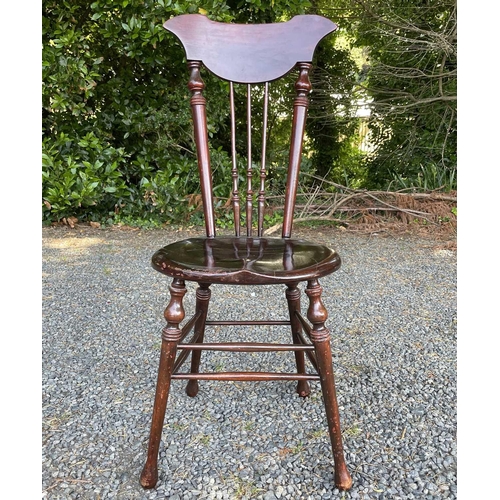 3052 - A Windsor type chair, possibly American, early 20th century, with circular 'penny' seat and shaped t... 