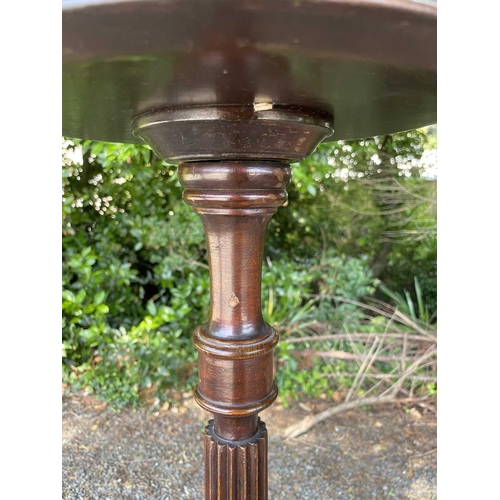 3054 - A mahogany torchere, of George III design, 1920s, with turned and fluted column on tripod base, heig... 