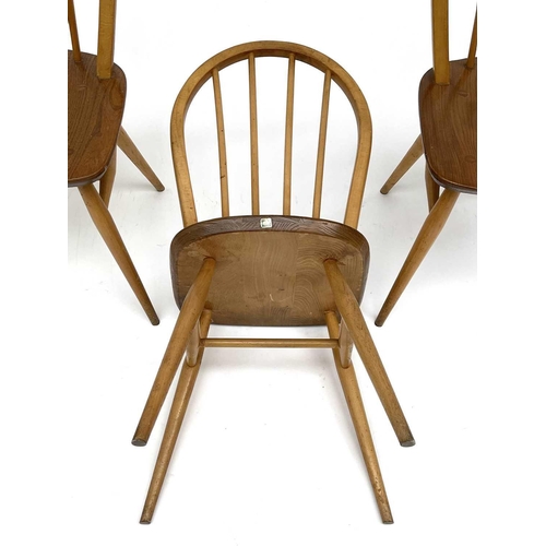 3056 - A set of three Ercol beech and light elm hoop back dining chairs, stamped to the underside with kite... 