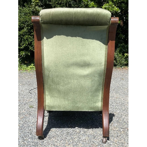 3057 - A late Victorian mahogany low salon chair, with green buttoned dralon upholstery and swept moulded f... 