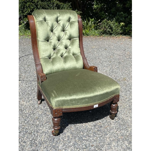 3057 - A late Victorian mahogany low salon chair, with green buttoned dralon upholstery and swept moulded f... 