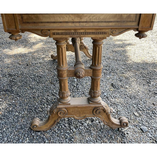 3058 - A Victorian walnut and inlaid Gothic style writing table, with leather inset skiver, within an inlai... 