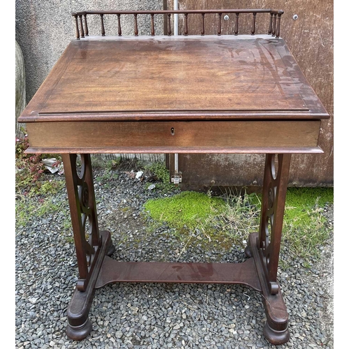 3059 - A Regency mahogany clerk's desk, with spindle gallery and sloping top, flanked by two drawers with b... 