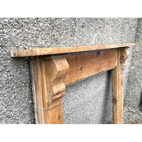 3062 - A late Victorian pine fire surround, height 112cm, width 142.5cm, together with a similar painted ex... 